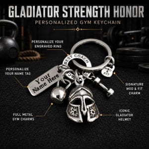 May include: A silver-toned metal keychain featuring a gladiator helmet charm, a kettlebell charm, a dumbbell charm, a small kettlebell-shaped charm with the text WOD & FIT, a rectangular tag with the text Your Name Here, and a ring with text.