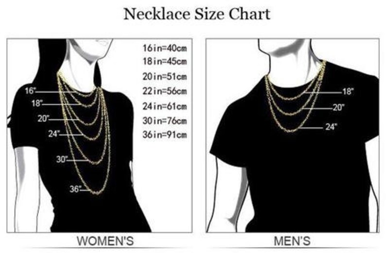 May include: Necklace size chart with measurements in inches and centimeters. The chart shows different necklace lengths on a model, with the measurements marked on the side.