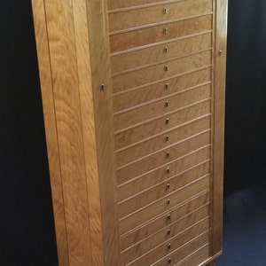 Large jewelry storage tower with twenty drawers and two doors, includes locks, custom dividers, hanging storage in the armoire, cabinet, box