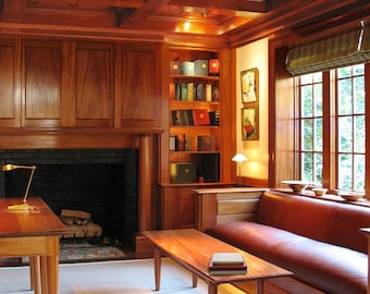 Handmade custom woodwork includes coffered ceiling, bookcases, wainscoting and other millwork, TV cabinet, and desk all from solid mahogany.