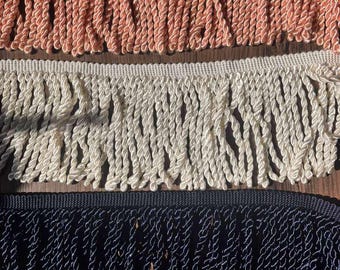 5in Decorative bullion fringe trim in three colors: white, blush pink, and navy blue.