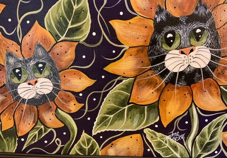 May include: Two black cats with green eyes are painted as sunflowers. The sunflowers are orange and yellow with green leaves. The background is a dark purple with white dots.