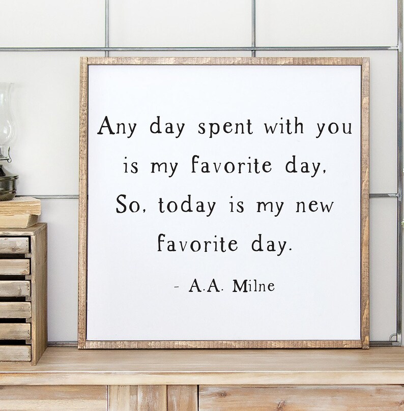 May include: A framed print with a white background and black text that reads "Any day spent with you is my favorite day. So, today is my new favorite day. - A.A. Milne"