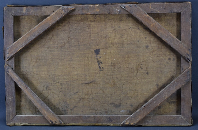 May include: The back of a wooden frame with a canvas stretched over it. The canvas is a light brown color and has some faint markings on it. The frame is made of dark wood and has a simple design.