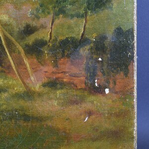 May include: A close-up of a painting depicting a landscape with trees and a path. The painting is on canvas and has a textured surface. The colors are muted and earthy, with shades of green, brown, and yellow.