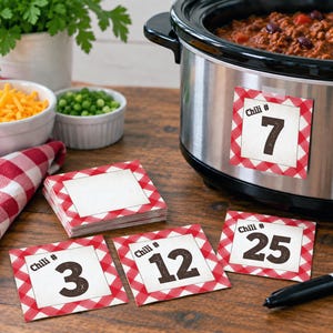 May include: A set of square paper labels with a red and white gingham border and a white center. The labels feature the text Chili # followed by a number. One label is attached to a stainless steel slow cooker, while others show numbers 3, 12, and 25.