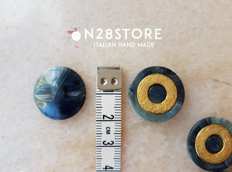 with golden central circles Beautiful gray marbled buttons