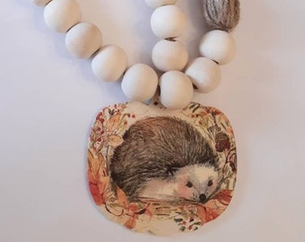 Wood beads with hedgehog,