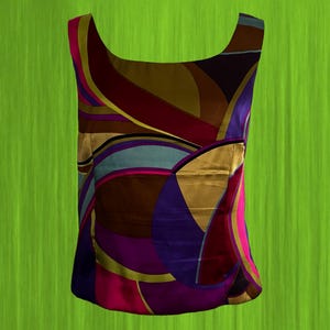 May include: A sleeveless top with a vibrant, abstract pattern in shades of gold, brown, purple, pink, and teal. The top features a scoop neckline and a fitted silhouette, perfect for a bold fashion statement.