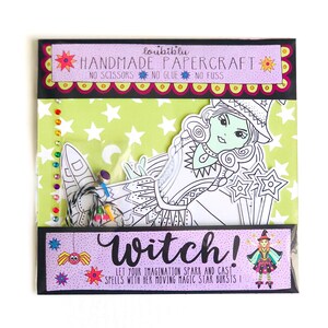 May include: A witch papercraft kit with a green and white witch illustration, a black spider, and a purple background. The text on the packaging reads "loubiblu HANDMADE PAPERCRAFT NO SCISSORS NO GLUE NO FUSS Witch! LET YOUR IMAGINATION SPARK AND CAST SPELLS WITH HER MOVING MAGIC STAR BURSTS!"