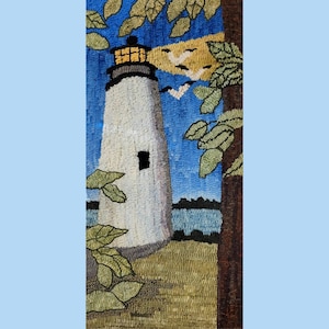 May include: A needlepoint rug depicting a white lighthouse with a yellow light on a blue background with a tree and birds in the sky.