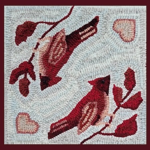 May include: A rug with a white background and two red cardinals perched on branches. The cardinals are surrounded by red leaves and hearts.