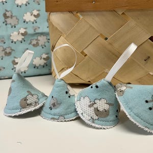 May include: A white ceramic mug with a black handle and the text "But First, Coffee" in a black, bold font. The mug is on a white surface.