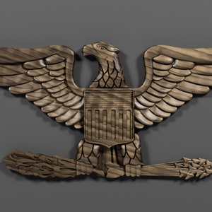 May include: A wooden carving of an eagle with outstretched wings, holding a shield with vertical stripes and a bundle of arrows in its talons. The eagle is a symbol of the United States.