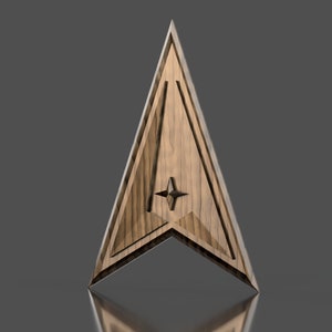 May include: A wooden triangular shaped ornament with a star in the center. The ornament has a wood grain pattern and a dark brown color.