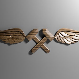 May include: A wooden sculpture of two crossed hammers with wings on either side. The hammers are brown and the wings are a light brown with white accents.