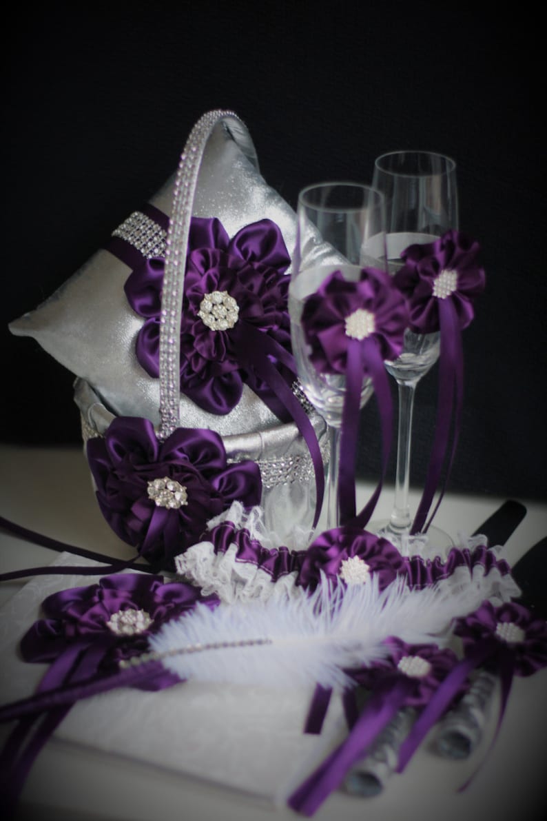Purple-themed wedding reception supplies - plum champagne glasses