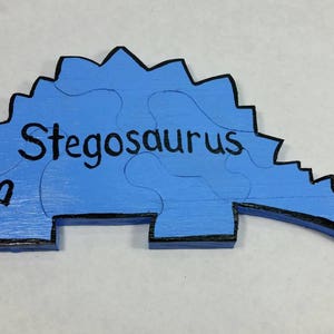 Stegosaurus Wooden Puzzle, Hand Painted Puzzle, Dinosaur Puzzle, Kids Puzzle, Light Blue With Dinosaur Name, Puzzle Fun, Toy, Lays Flat.
