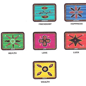 May include: Six colorful square cards with Aboriginal art designs. Each card features a different design and the word "FRIENDSHIP", "HAPPINESS", "HEALTH", "LOVE", "LUCK", or "WEALTH" printed below the design.