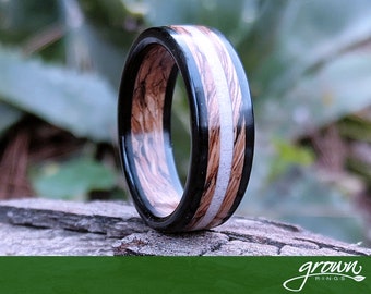 Tennessee Whiskey Barrel and Ebony Spiral Grain Wood Ring with Antler Inlay. Handmade, Custom, Wooden Wedding Bands by Grown Rings.
