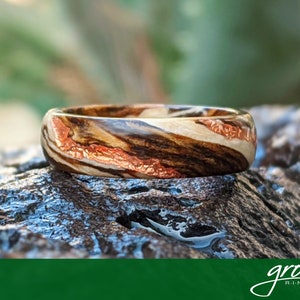 Driftwood Bocote Spiral Grain Wood Ring with Rose Gold Veins. Handmade Custom Wedding Rings by Grown Rings