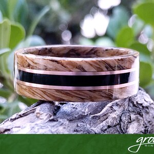 Tennessee Whiskey Barrel and Ebony Spiral Grain Wood Ring with Twin Ring Rose inlays. Handmade, Custom, Wooden Wedding Bands by Grown Rings.