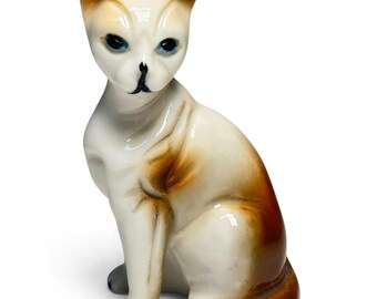 Figurine de chat assis en céramique vintage années 50, yeux bleus, glaçure crème et marron, Japon