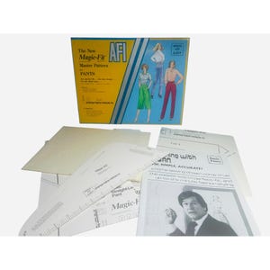 May include: A vintage sewing pattern set for pants, featuring a box with the text "The New Magic-Fit Master Pattern for PANTS." The box has illustrations of women in pants. Several pattern pieces and instructions are visible.