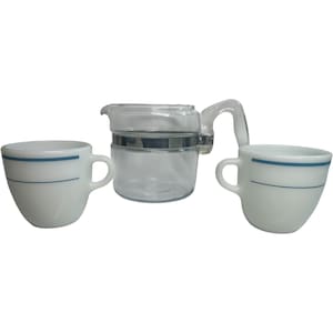 May include: A vintage coffee set featuring two white mugs with a blue stripe and a clear glass carafe with a silver band. The mugs have a rounded shape and a handle. The carafe has a handle and a lid.