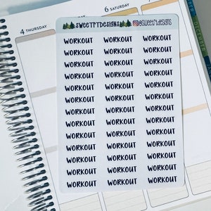 May include: A sheet of white stickers with the word "WORKOUT" repeated 18 times in black text. The stickers are designed for use in a planner or journal.