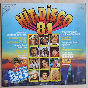 May include: A vinyl record cover for the album "Hit Disco 81" featuring a collage of photos of various artists, including Joe Dolce, Precious Wilson, Robert Palmer, Eruption, Bernie Paul, Kelly Marie, Ultravox, A La Carte, Blondie, Leo Sayer, and Amanda Lear. The album cover features the text "Die neue Super 20" and "International/Original".
