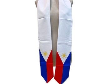 May include: White graduation stole with the Philippine flag on the ends. The flag is red, white, and blue with a yellow sun and stars.