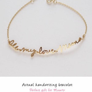 May include: A gold-toned metal chain bracelet featuring a central script-style inscription that reads "all my love Mama" in cursive lettering. The delicate chain includes a circular spring ring clasp closure at the end of the bracelet design.