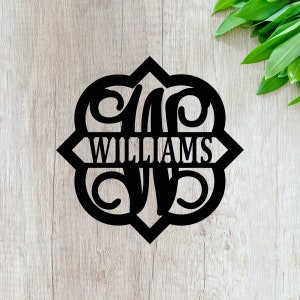 May include: Black metal monogram with the letter "W" and the name "WILLIAMS" in a decorative font.