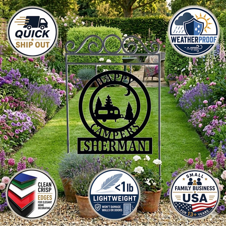 May include: Black metal garden sign with the words "Happy Campers" and a camper silhouette. The sign includes the name "Sherman" and is displayed in a garden setting with flowers and grass. The sign is lightweight and weatherproof.