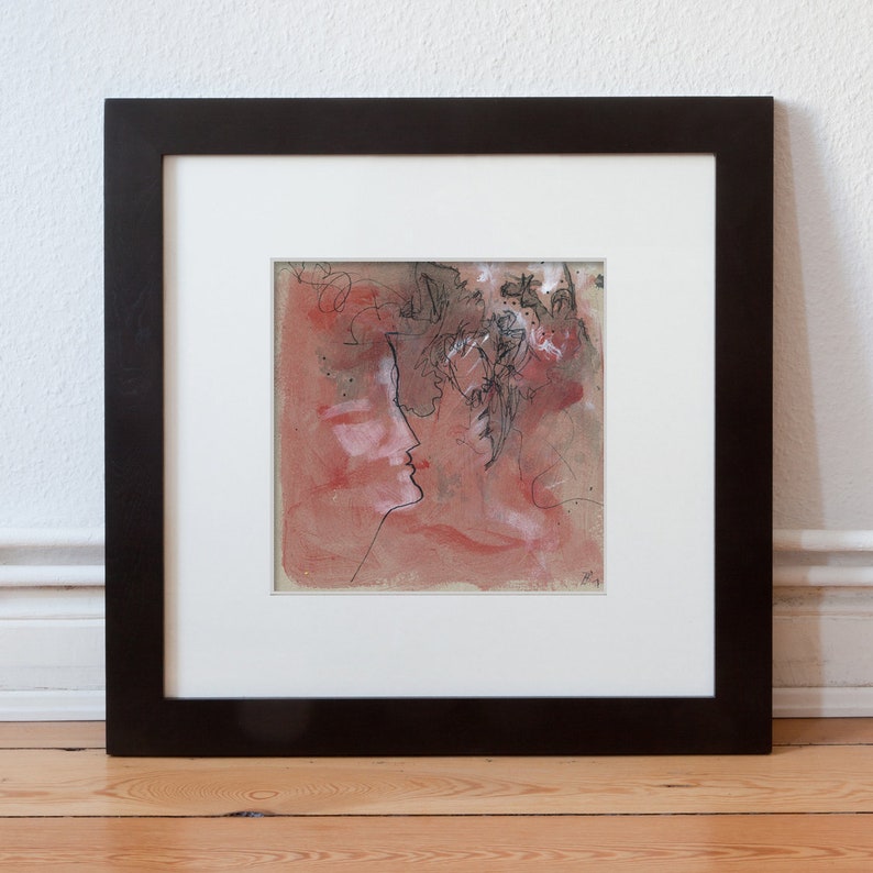 May include: A framed abstract painting with a red background and black ink lines. The painting depicts a profile of a person's face with a crown of flowers.