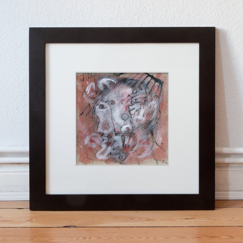 May include: A framed abstract painting of a face with black and white lines and a red background.