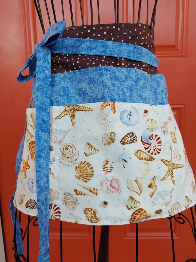 Six pocket half/server apron.  Extra long straps that can be tied in front or back.  Perfect pocket size's for server booklets.