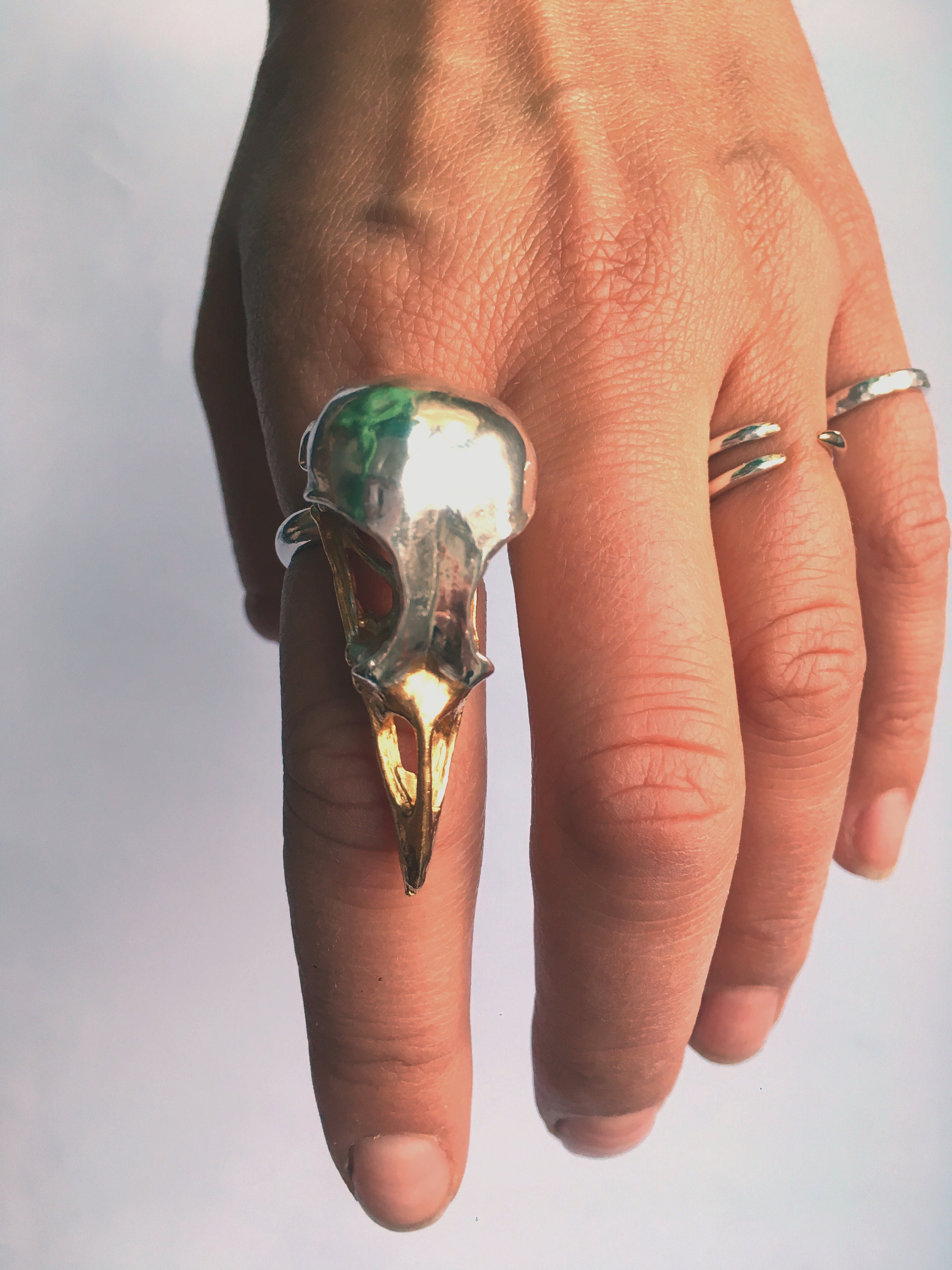Unique sterling silver bird skull statement ring with a 24ct yellow gold beak
