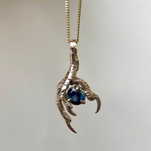 9ct yellow gold and Sapphire bird claw pendant necklace
