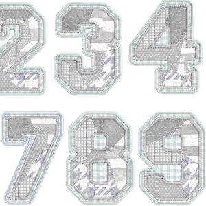 May include: A set of ten gray and white patchwork numbers, 0-9, with a light blue outline. Each number is composed of various fabric patterns, including houndstooth and gingham, creating a textured appearance. Ideal for crafting or educational projects.