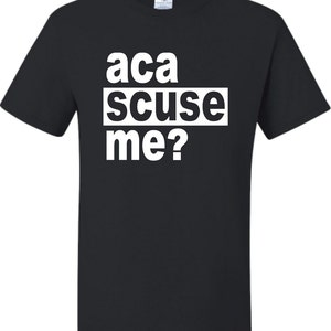 May include: Black t-shirt with white text that reads "aca scuse me?"