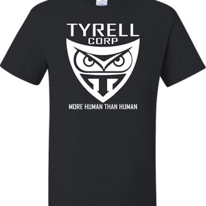 May include: Black t-shirt with a white graphic of the Tyrell Corp logo. The logo features an owl with the text "Tyrell Corp" above and "More Human Than Human" below.