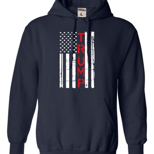 May include: Navy blue hooded sweatshirt with a distressed American flag design and the word "TRUMP" in red lettering.