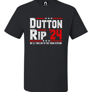 May include: Black t-shirt with a white and red graphic that says "Dutton Rip '24" and "We'll take em to the train station".