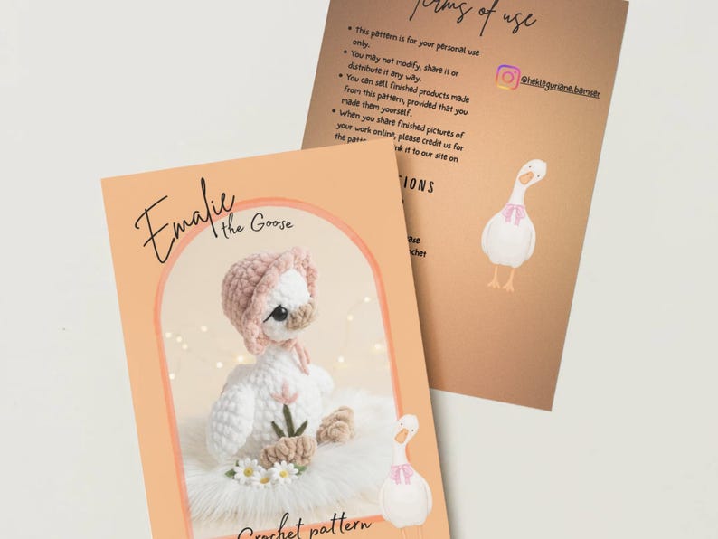 May include: An image of two cards. One card features a crochet goose wearing a pink bonnet and a pink bow. The other card has the text "Terms of Use" and a drawing of a goose with a pink bow. The text "Emalie the Goose Crochet pattern" is also visible.