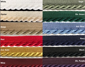 May include: A selection of 12 colors of decorative trim, including white, oyster, sage, dark green, antique blue, beige, red, antique gold, wine, navy, black, and dark purple. The trim is a twisted rope style with a scalloped edge.