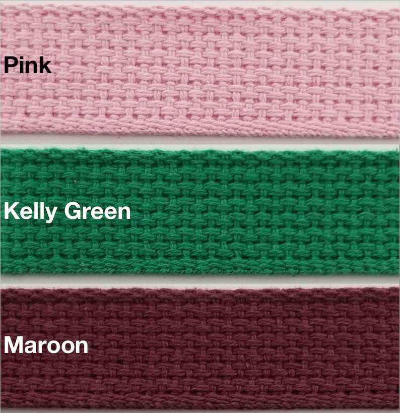 May include: Three fabric samples in pink, kelly green, and maroon. The fabric is a woven cotton webbing.