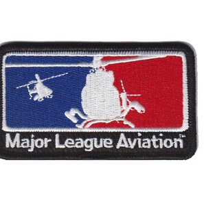 May include: Embroidered patch with a black border, a blue, white, and red background, and the text "Major League Aviation" in white. The patch features a white silhouette of a helicopter.