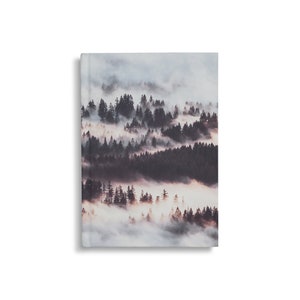 May include: A misty forest scene with a soft, ethereal glow. The trees are silhouetted against the fog, creating a sense of mystery and tranquility.